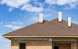 Roof with three white and new chimney